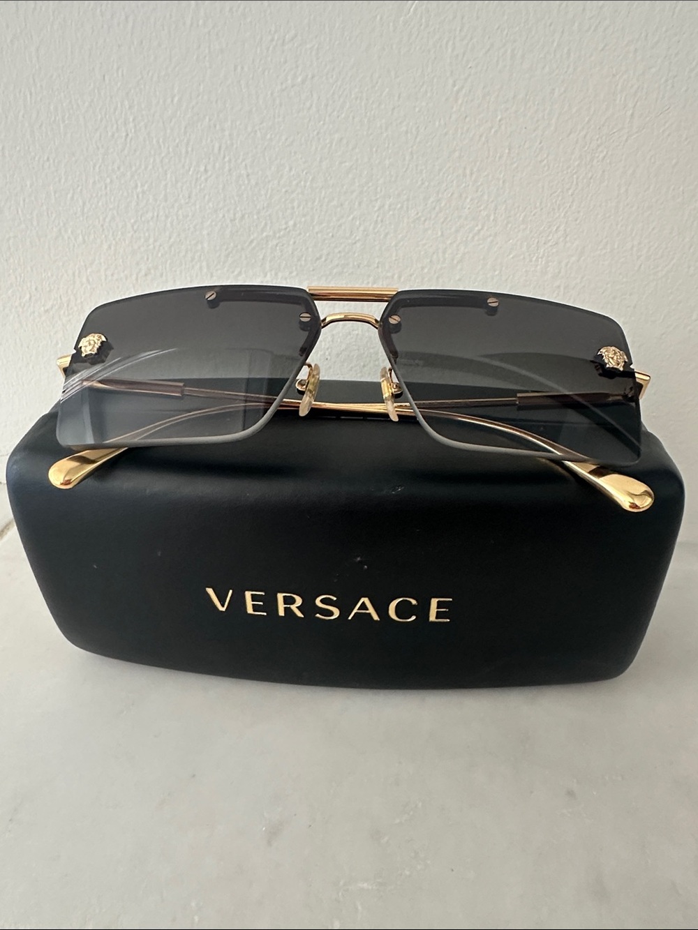 Versace Men’s Gold & Black Gradient Rimless Sunglasses